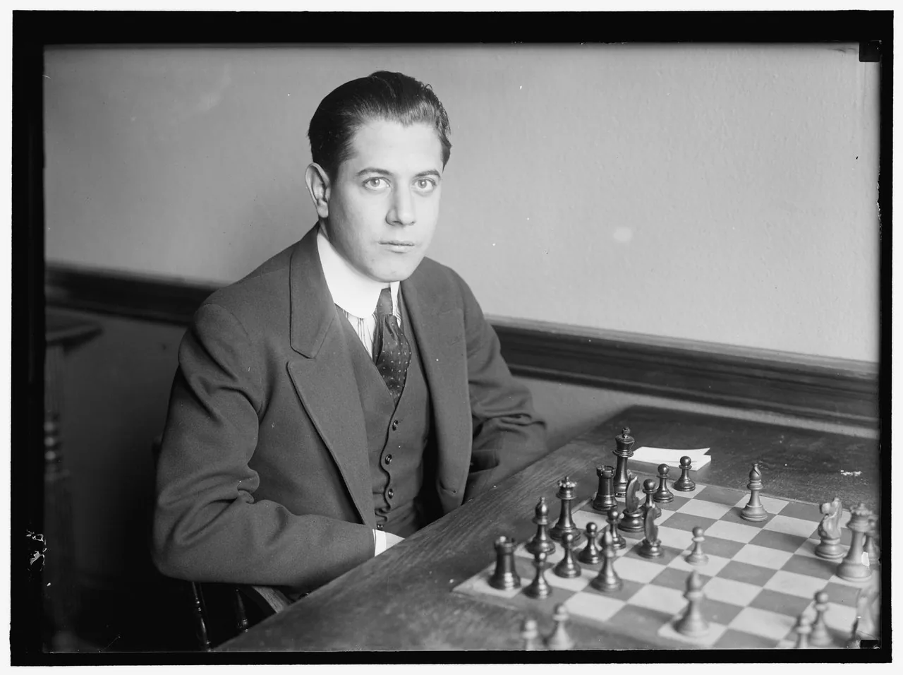 José Capablanca seated at a chessboard