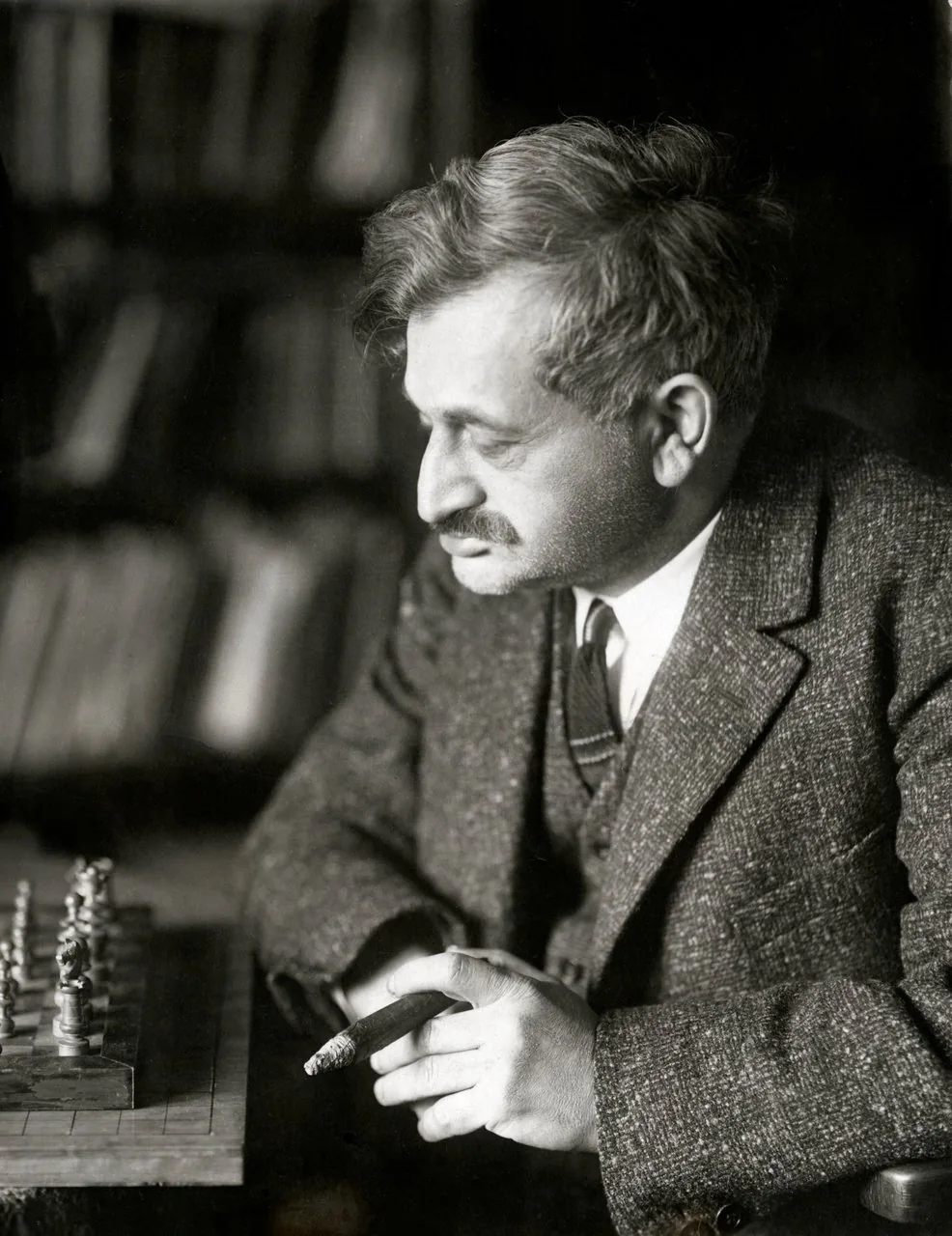 Emanuel Lasker seated at a chessboard in 1928